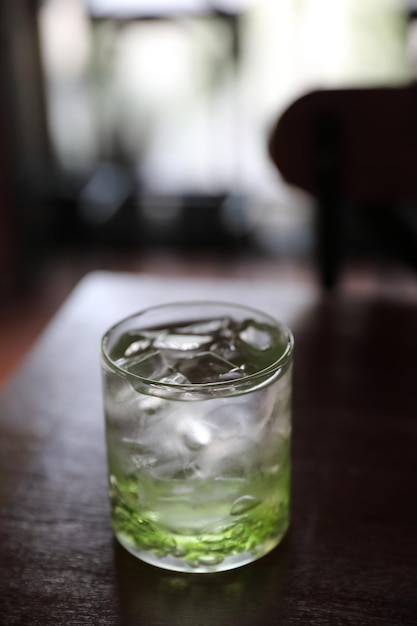 Water in glass in wood background