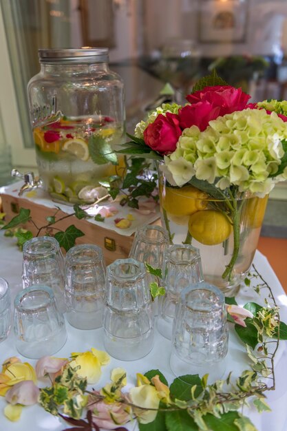 Water glasses on a table for refreshment enriched with lemons and herbs water