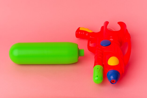 Water gun isolated on pink background