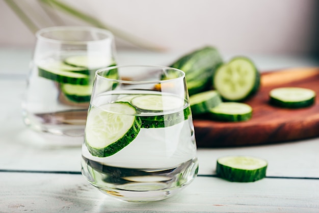 Water infused with sliced cucumber in a drinking glass