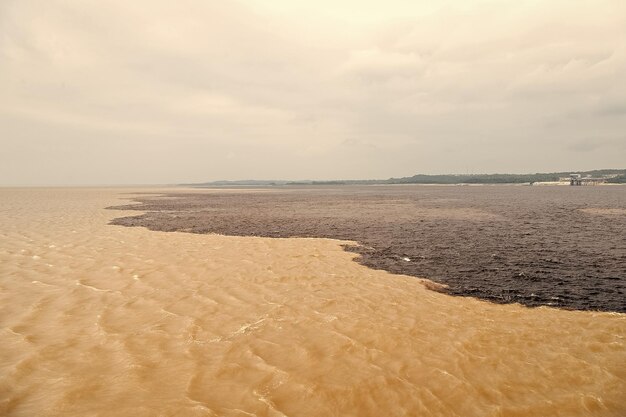 Water meeting in brazil amazon river with rio del negro