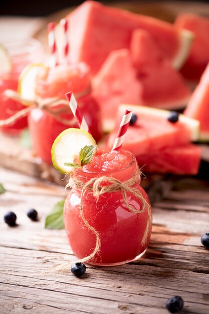 Water melon smothie on wooden table. Healthy drinks concept