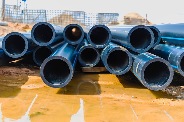 Water pipes for drinking water supply lie on the construction site preparation for earthworks for laying an underground pipeline modern water supply systems for a residential city