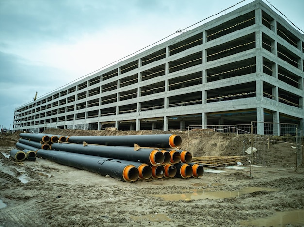 Photo water pipes for supplying communications lie on the construction site