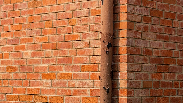 Water piping system install at the orange brick wall