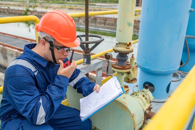 Water plant maintenance technicians mechanical engineers check the control system at the water treatment plant