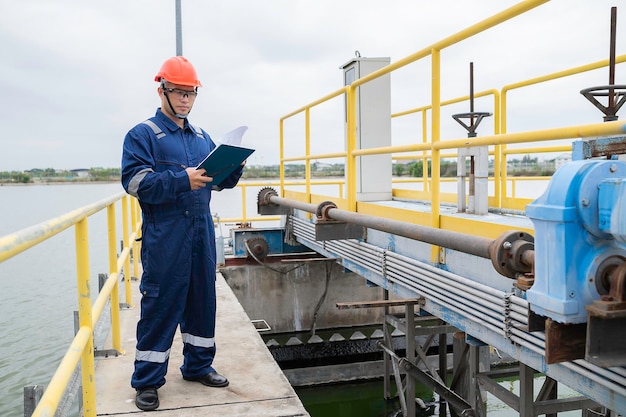 Water plant maintenance technicians mechanical engineers check the control system at the water treatment plant