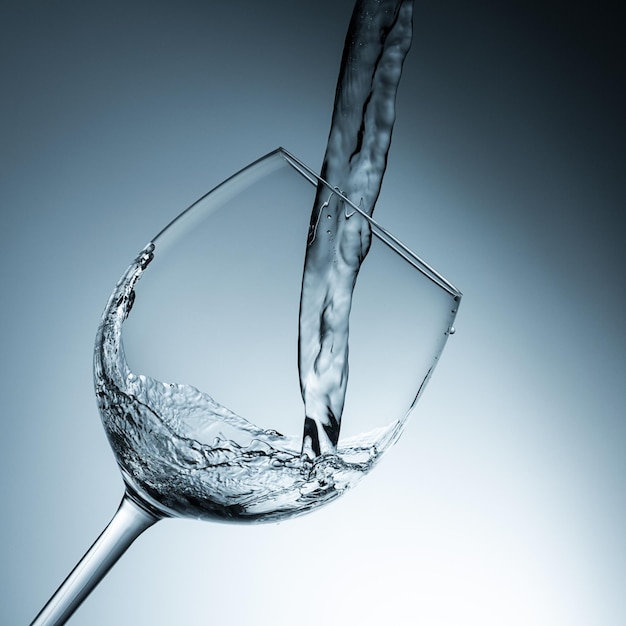 Water pouring in a wine glass