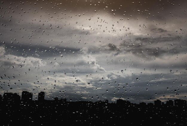 Water and raindrops on the glass