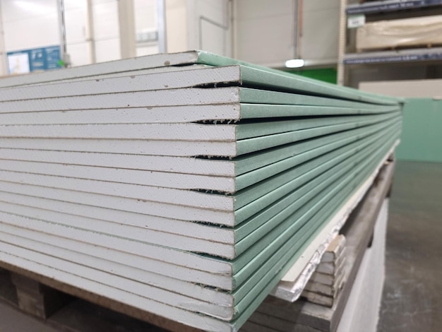 Water resistant plasterboard sheets stacked in a hardware store