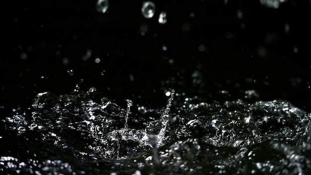 Water splash on black background color which represent clean and pure natural freshness of liquid for healthy drink or sparkling water