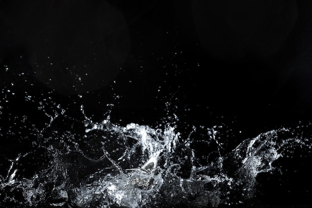 Water splash on black background, fresh feeling 