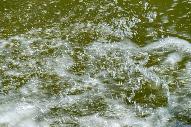 Water splash from a running boat in Danube Delta,  Dobrogea region,  Romania,  in a sunny summer days, 2021