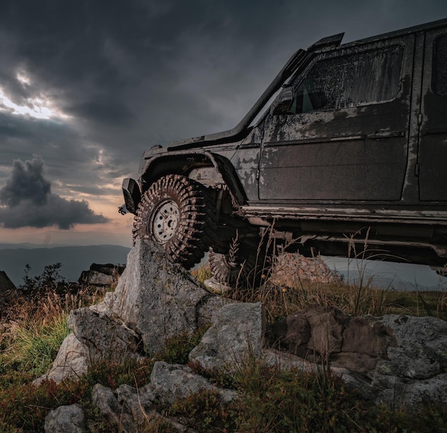 Water splash in offroad racing off road jeep expedition to the villages on mountain road