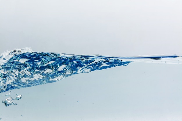 Water splash with bubbles of air, isolated on the white background