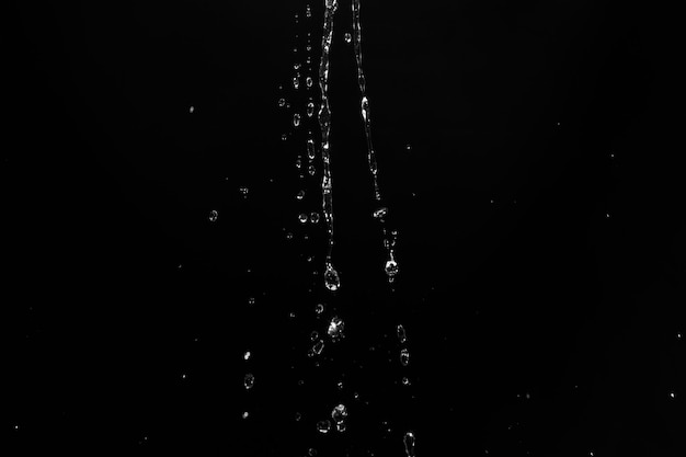 Water splashes isolated on black background white jets with drops