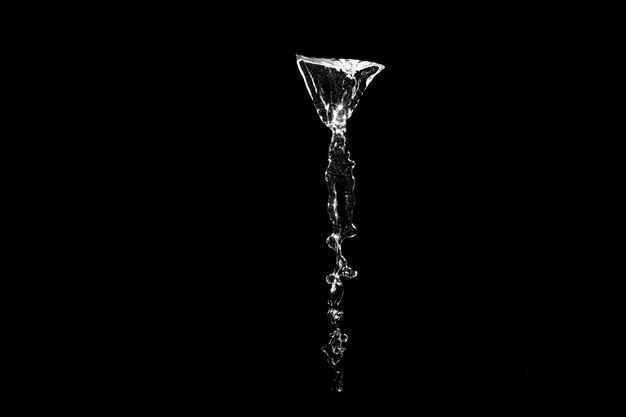 Water splashes isolated on black background white jets with drops