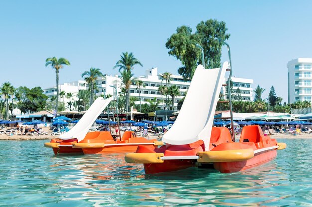 Water sports equipment, catamarans on Nissi beach in Cyprus.