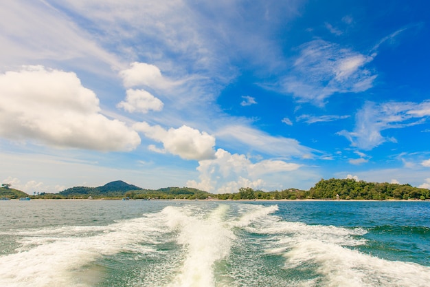 Water stream after speed boat in tropical ocean