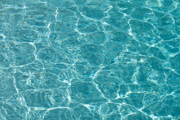 Water in swimming pool background with high resolution wave abstract or rippled water texture