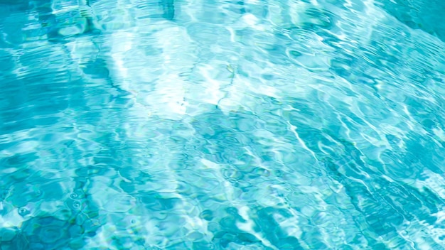 Water swimming pool texture and surface water on pool reflection blue wave nature water on the outdo.