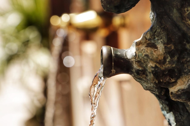 A water tap with the word water on it