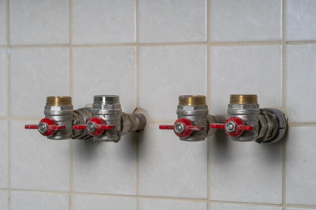 Water taps for connecting a gas boiler on tiled wall