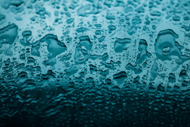 Water texture abstract background aqua drops on turquoise glass as science macro element rainy weather and nature surface art backdrop for environmental brand design