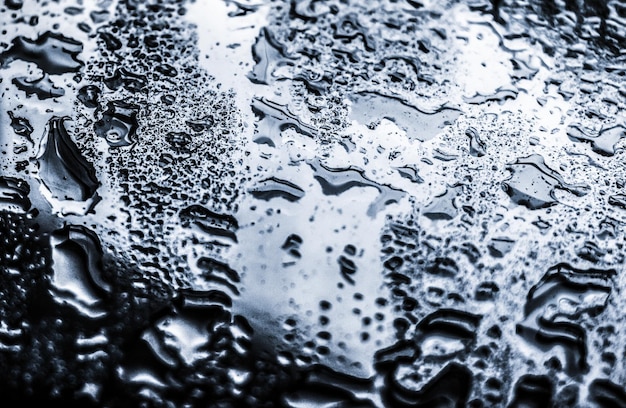 Foto water textuur abstracte achtergrond aqua druppels op zilver glas als wetenschap macro element regenachtig weer en natuur oppervlakte kunst achtergrond voor milieu merk design