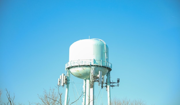 A water tower is shown in a photo.