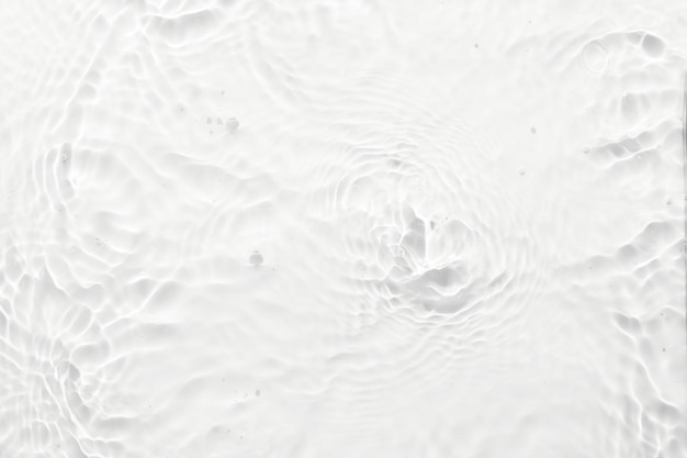 Water white surface abstract background Waves and ripples texture of cosmetic aqua moisturizer with bubbles