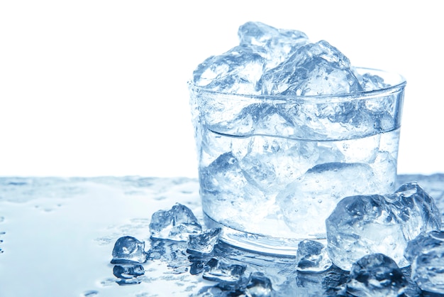 Water with ice cubes in glass