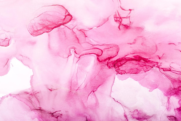 Watercolor alcohol ink swirls transparent waves and swirls in pink magenta colors