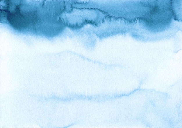 Watercolor blue and white ombre background texture. Sea blue gradient backdrop. Watercolour stains on paper, hand painted.