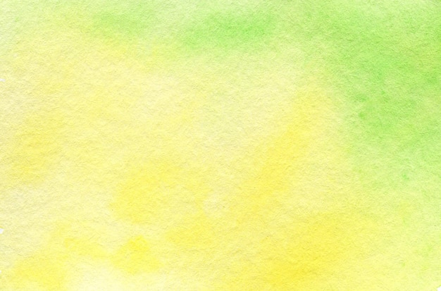 Watercolor hand painted abstract yellow green background subtle ink gradient on textured paper