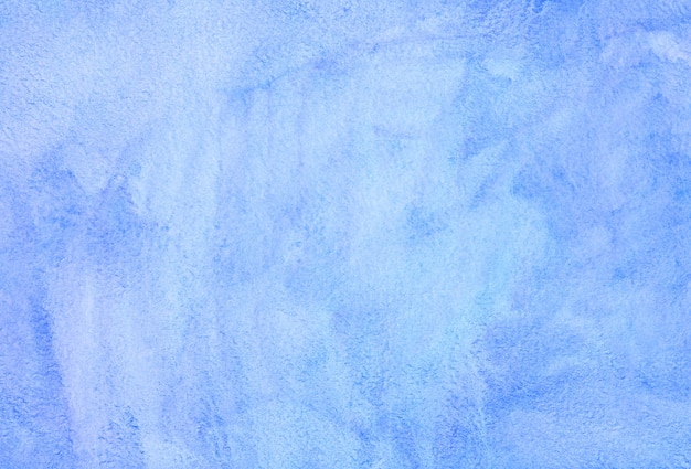 Watercolor watery light blue background painting. Hand painted watercolour backdrop texture. Sky blue stains on paper.