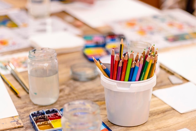 Watercolor workshop school supplies jar with colored pencils