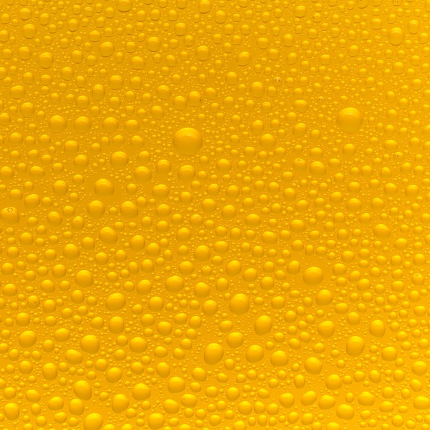 Waterdruppels op bierglas