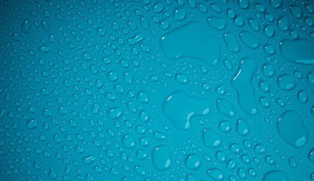 Waterdruppels op blauwe achtergrond. Wereld Water Dag Concept. Druppel textuur oppervlak. Milieu Zorg. MVO, Maatschappelijk Verantwoord Ondernemen of CSC, Maatschappelijk Bijdragen