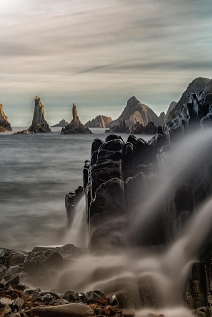 Waterfall on the beach of gueirua in cudillero