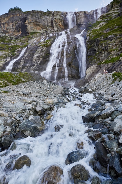 Waterfall in the Caucasus mountains, melting glacier ridge Arkhyz, Sofia waterfalls. Beautiful high mountains