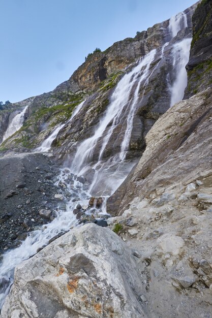 Waterfall in the Caucasus mountains, melting glacier ridge Arkhyz, Sofia waterfalls.