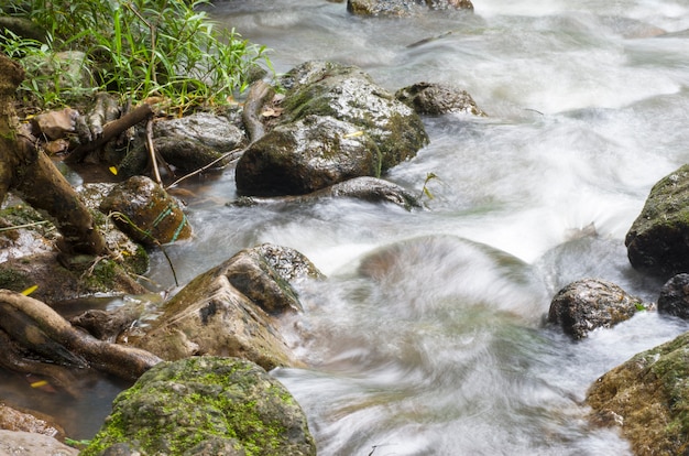 Waterfall flows through the rocks.