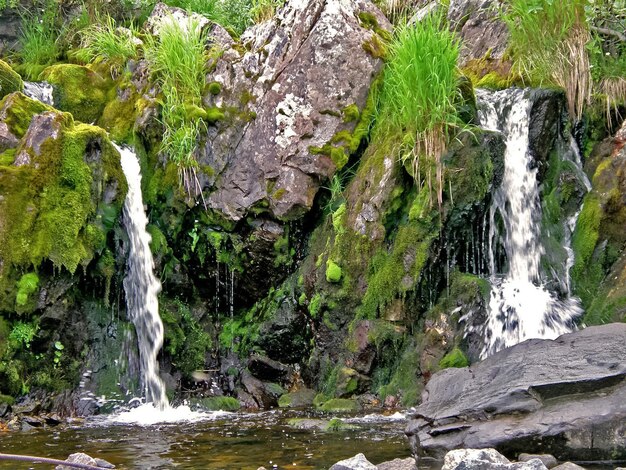 Waterfall from the thawed waters Melting snow in the hilly tund