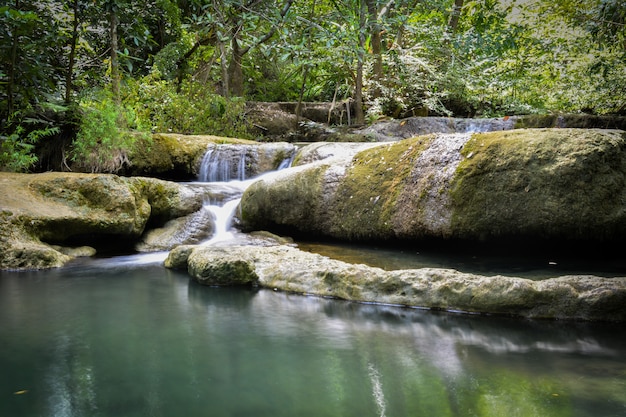 Waterfall hidden in the tropical jungle (erawan waterfall) in kanchanaburi province asia southeast asia Thailand