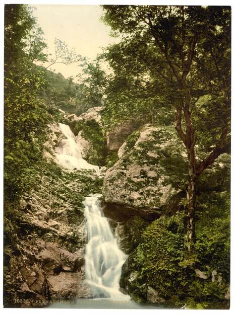 a waterfall is in the foreground and the picture is from the bottom right