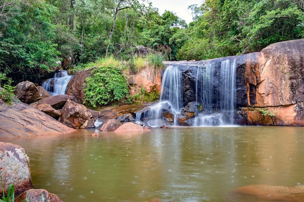 Waterfall and lake in rain forest of Moeda in Minas Gerais state