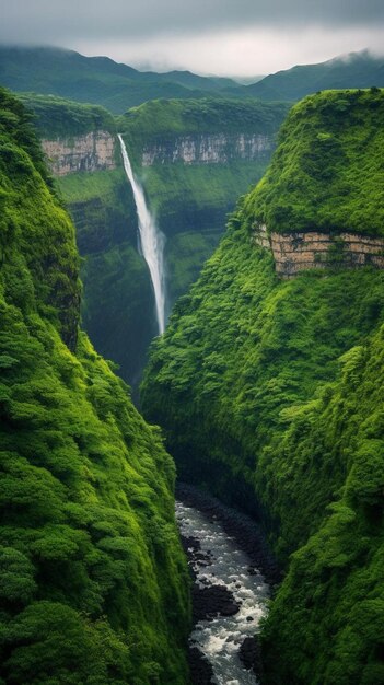 a waterfall in the middle of a lush green valley