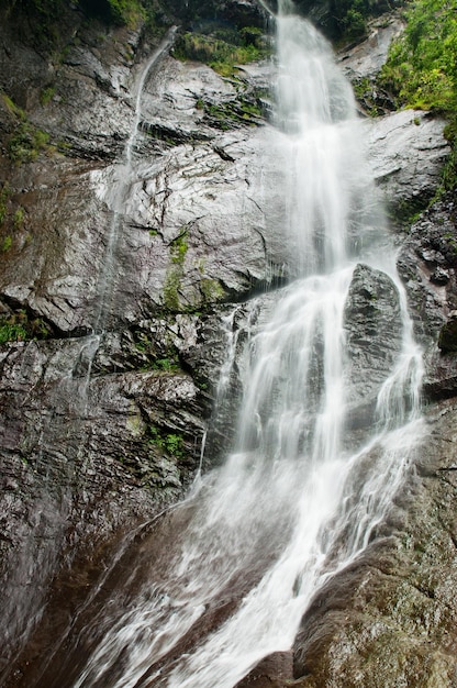 Waterfall in the mountains, long exposure, natural background