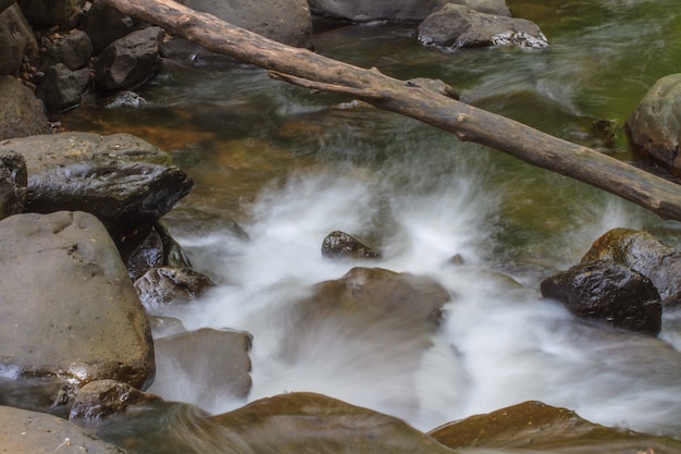 Waterfall and rocks covered with moss